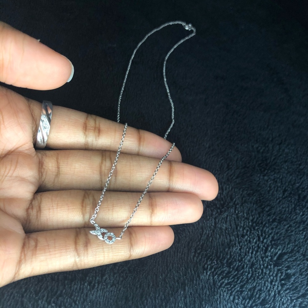 100% Sterling Silver “XO” necklace.